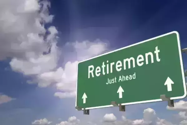 Road sign with the word  Retirement Just Ahead and arrows pointing forward